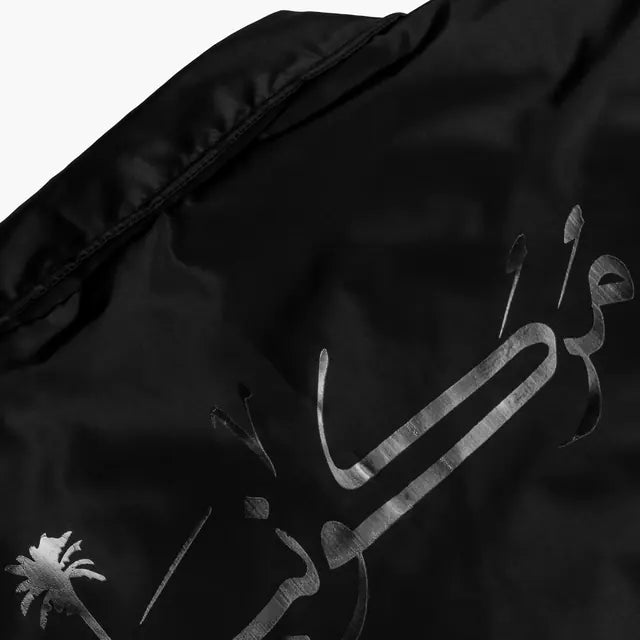 Calligraphy print on the coach jacket